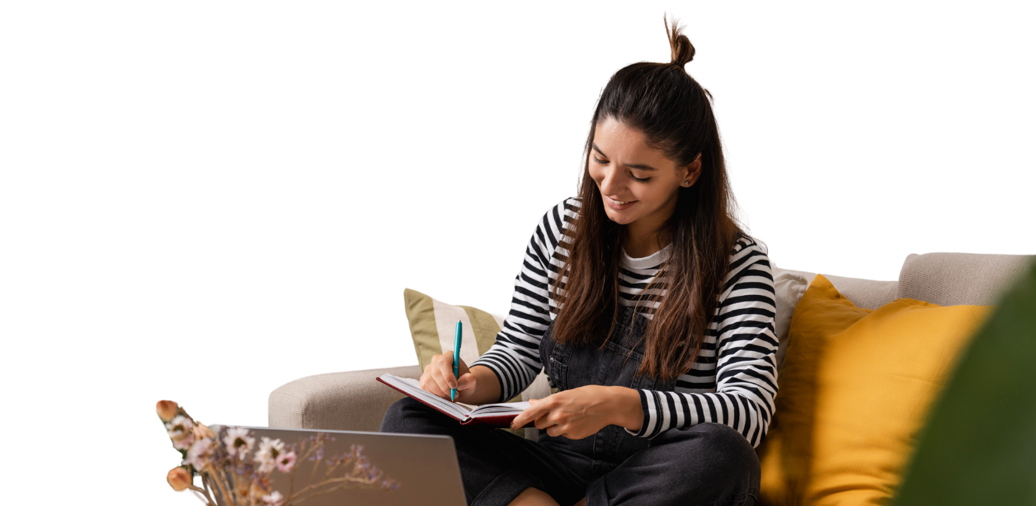 Young female is studying at home on a couch