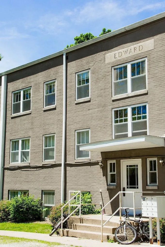 Three-story brick apartment building named Edward